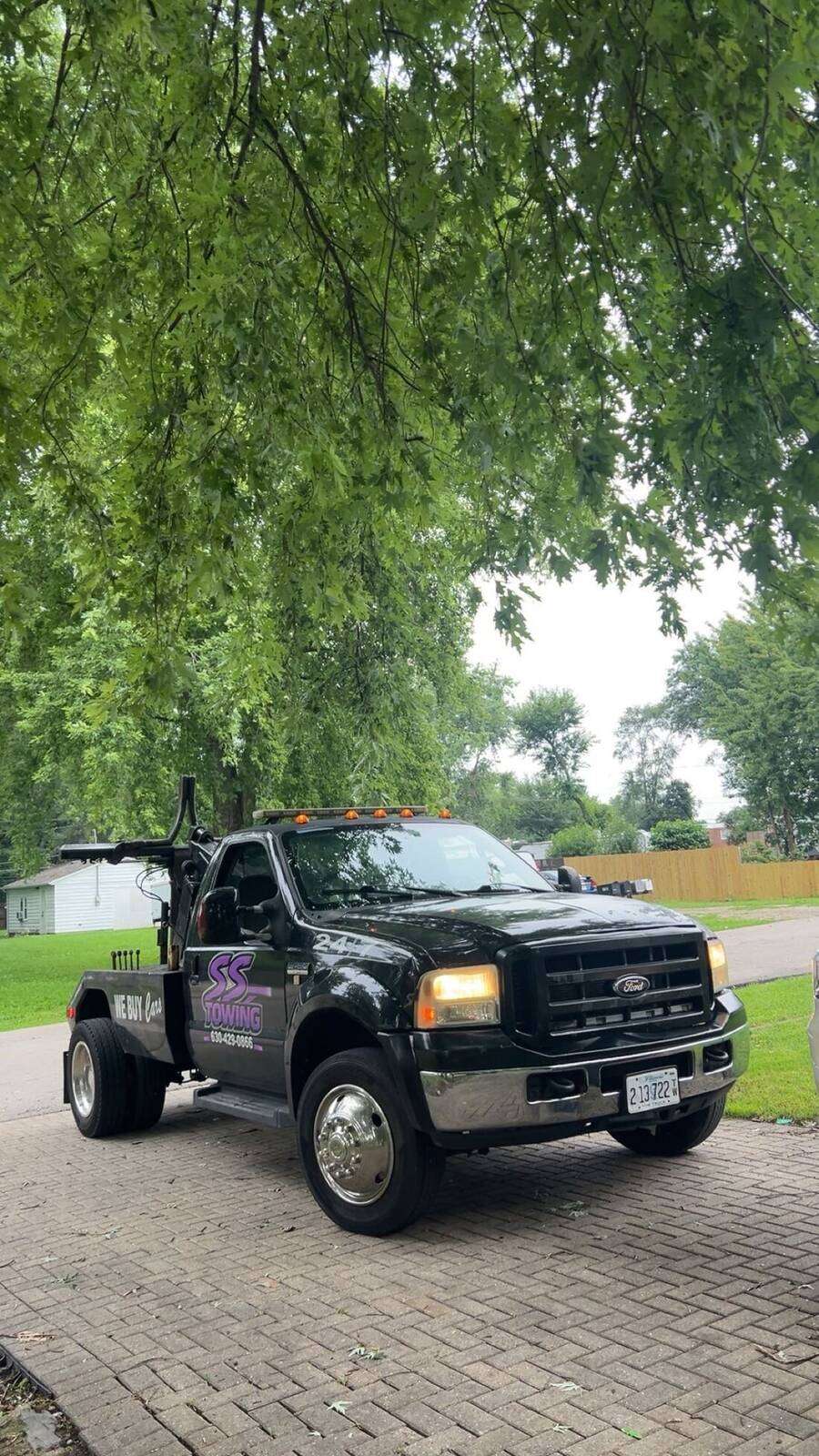 SS Towing wrecker truck parked and ready to roll